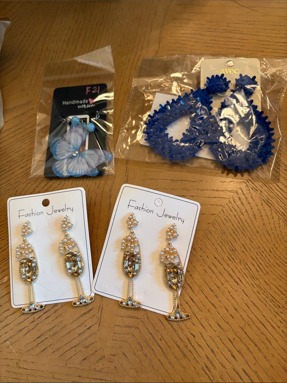 Champagne earrings , blue sequin earrings and butterfly’s .